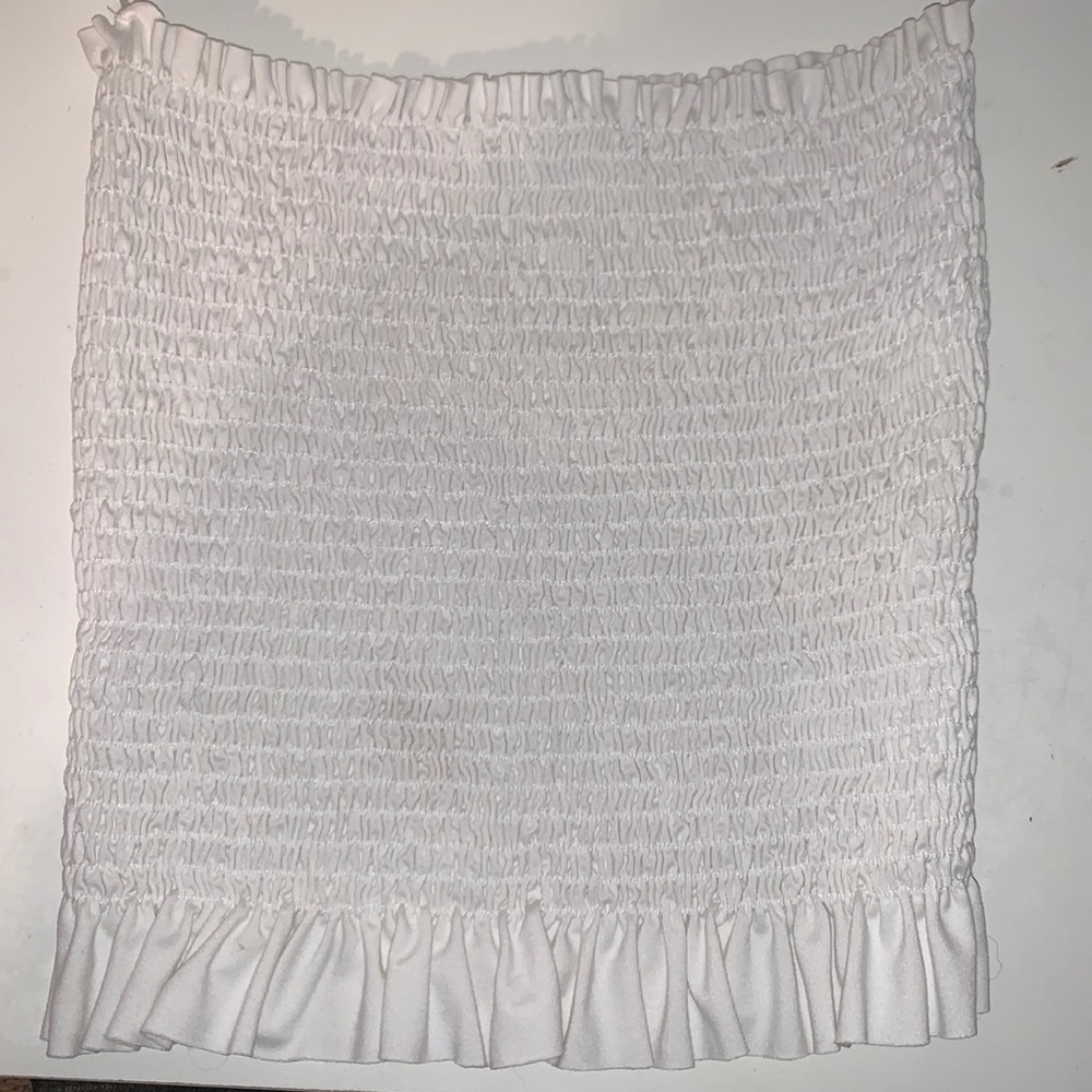 White tube top with ruffle detail at bottom!